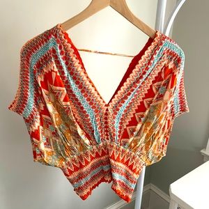 Summery tangerine/teal v neck top.